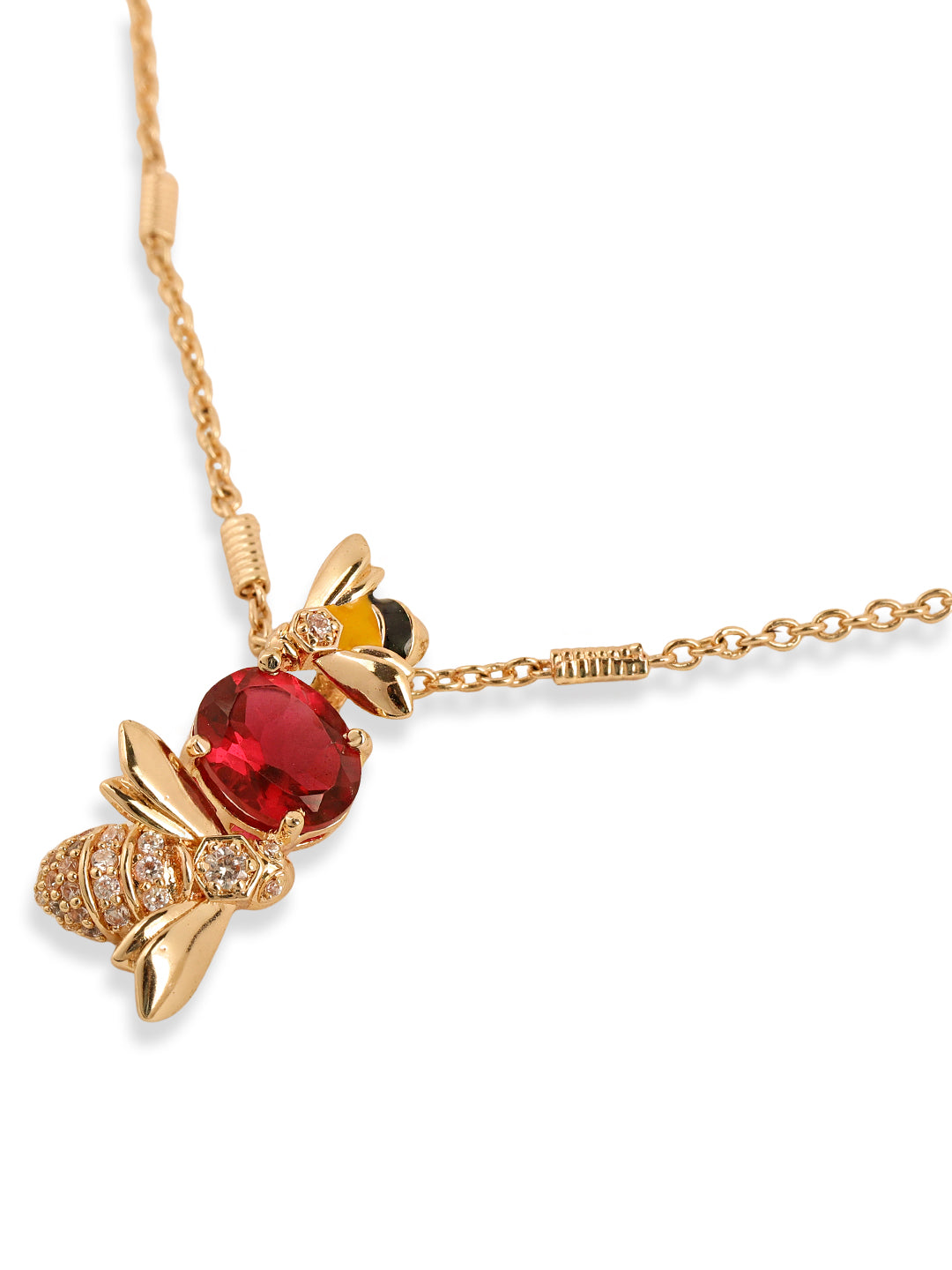 Gold bee-shaped necklace with a red gemstone on a white background